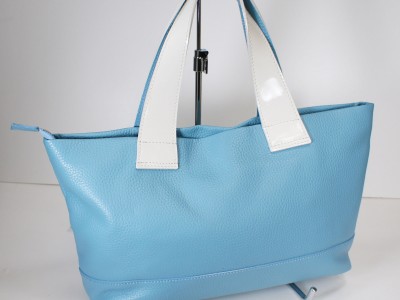 This lightweight bag is made of soft shrink with matching enamel.